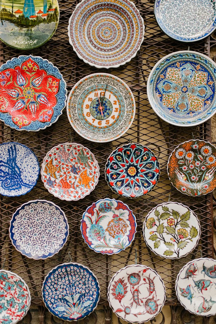 Services A diverse assortment of intricately decorated ceramic plates with oriental designs on display.